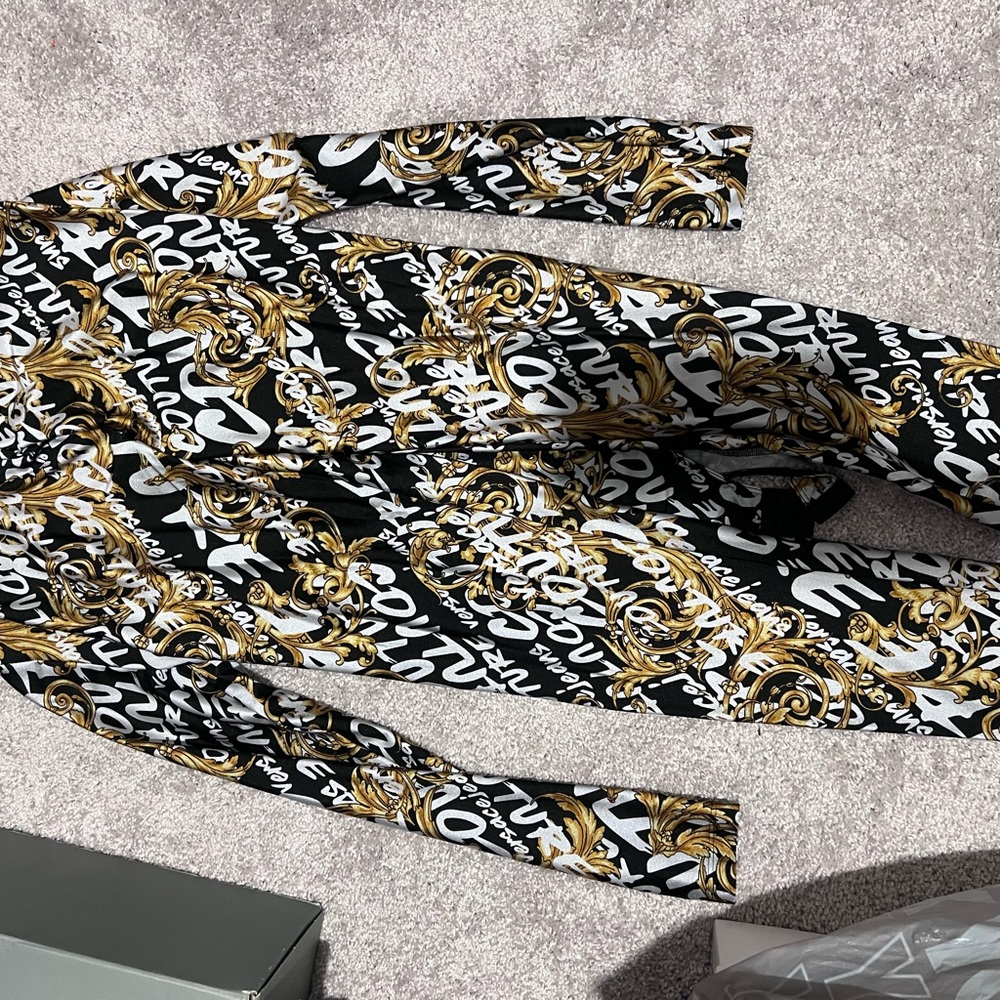 Versace black and gold leggings